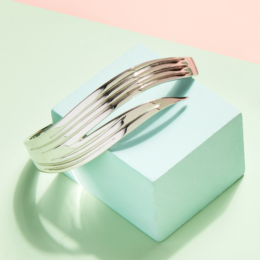 Photo of Dorado bangle on green and pink background