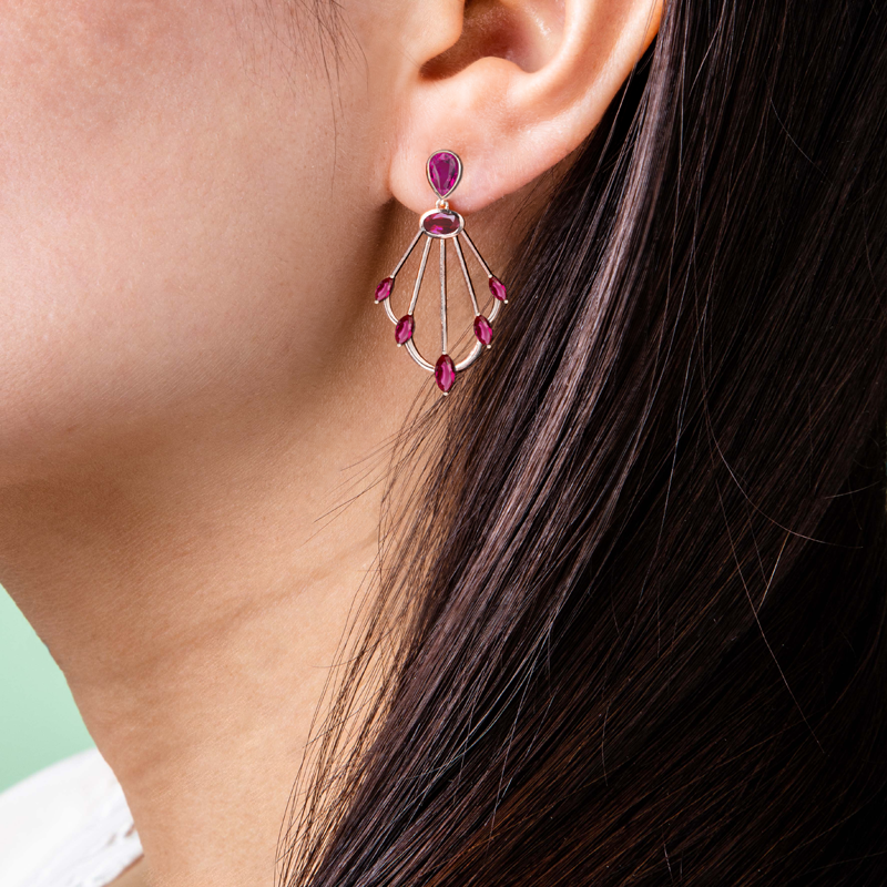 Photo of Sedna rhodolite scepter earrings on ear