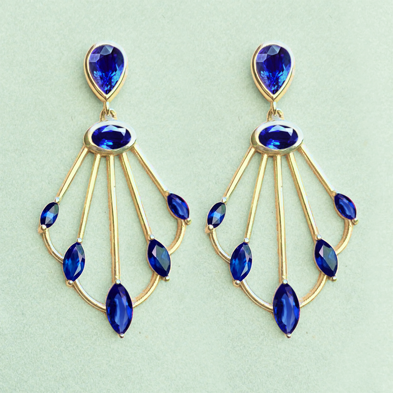 Photo of Sedna sapphire scepter earrings on green background