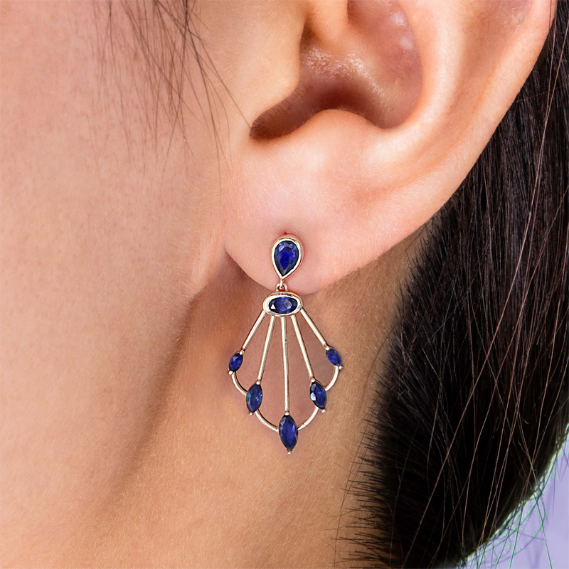 Photo of Sedna sapphire scepter earrings on ear