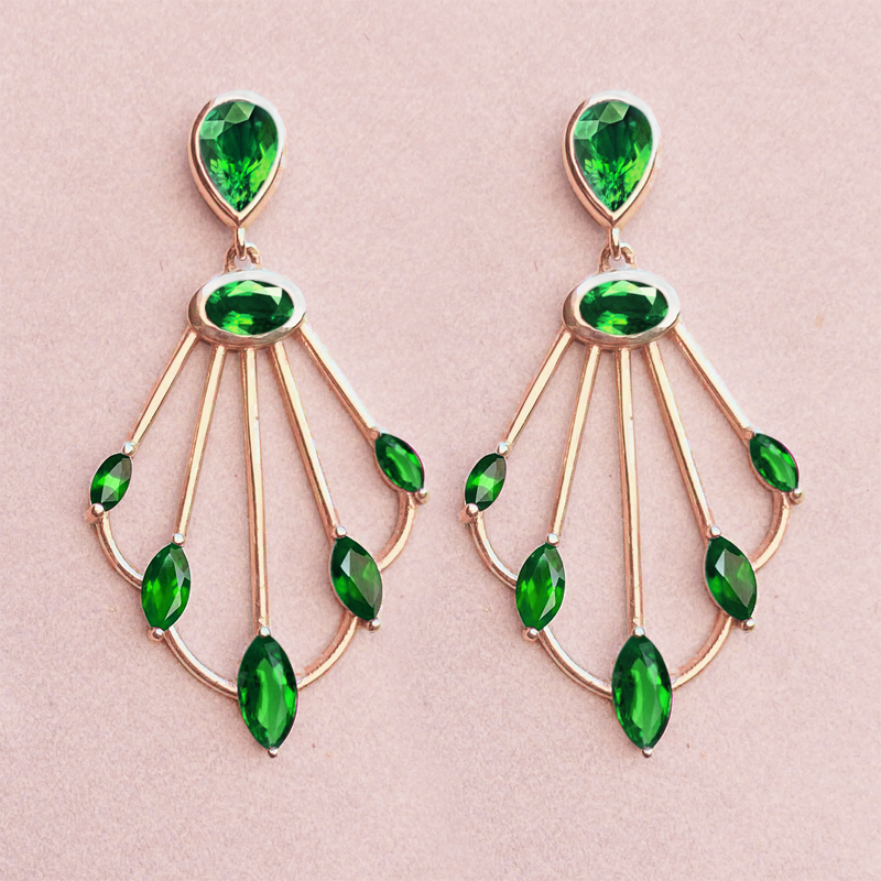 Photo of Sedna tsavorite scepter earrings on pink background