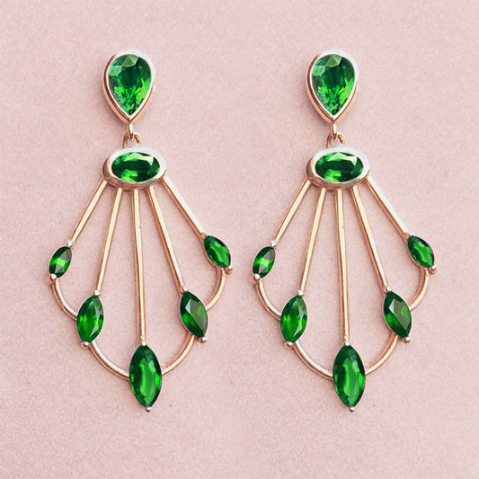 Photo of Sedna tsavorite scepter earrings on pink background